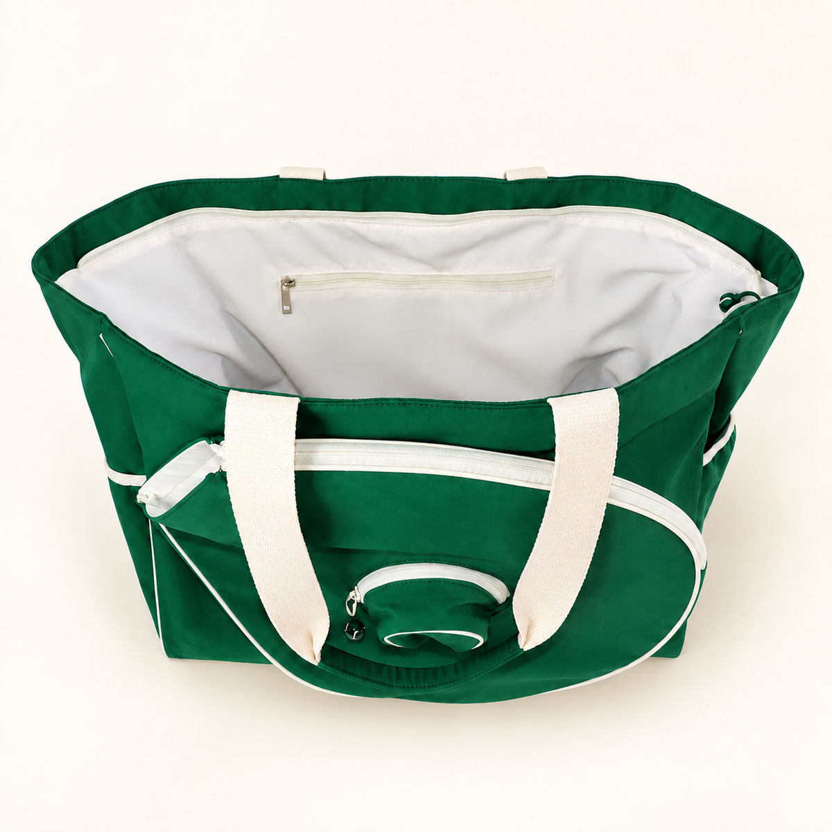 Open green Tennisea Court Tote showing the white-lined interior